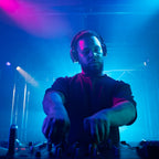 DJ performing with AlphaTheta HDJ-F9 headphones
