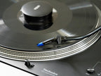 Ortofon Concorde Music Blue turntable cartridge mounted on Technics turntable, showcasing sleek blue design and stylus.