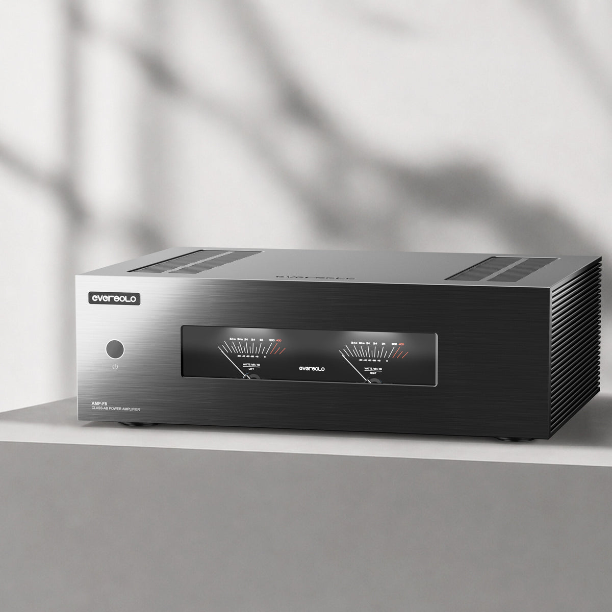 Eversolo AMP-F8 power amplifier on a concrete shelf in soft daylight